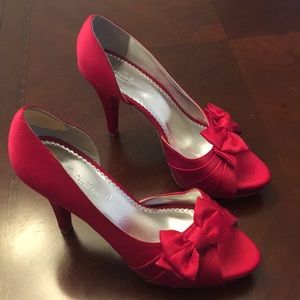 Red satin peep toe pumps